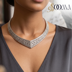 Model in grey V-neck blouse wearing handcrafted oxidized silver geometric V-neck Hasli choker