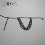 Sooma brand silver-tone layered curb chain armlet displayed flat on dark slate background