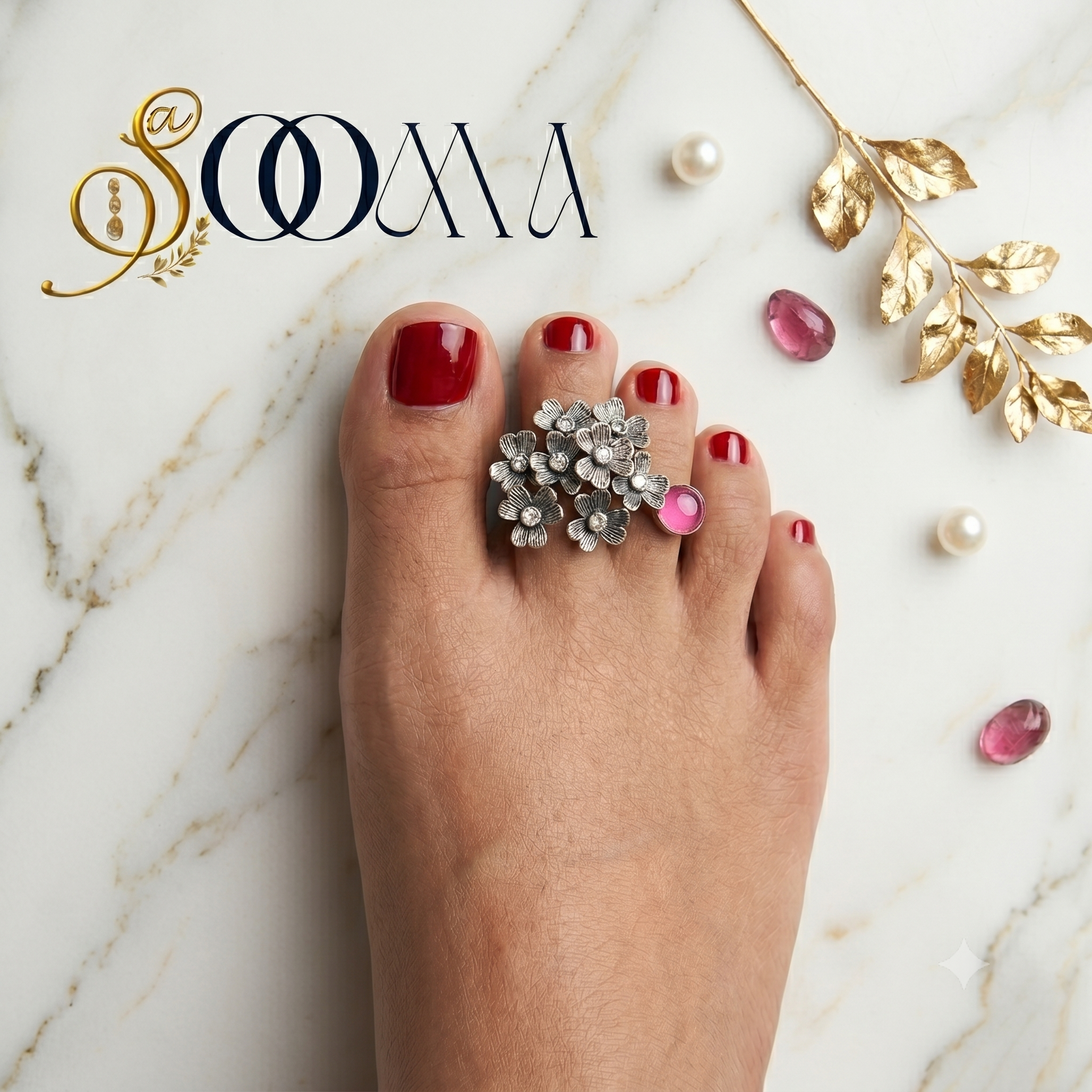 "Top down view of handcrafted silver floral bichhiya with pink gemstone accent on an Indian foot"