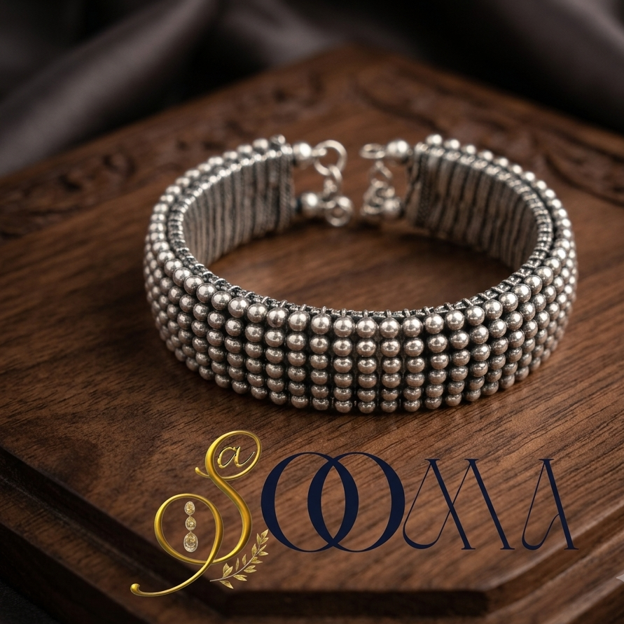 Close up shot of Sooma brand designer minimalist silver open bangle showing the clean architectural finish on a premium textured background