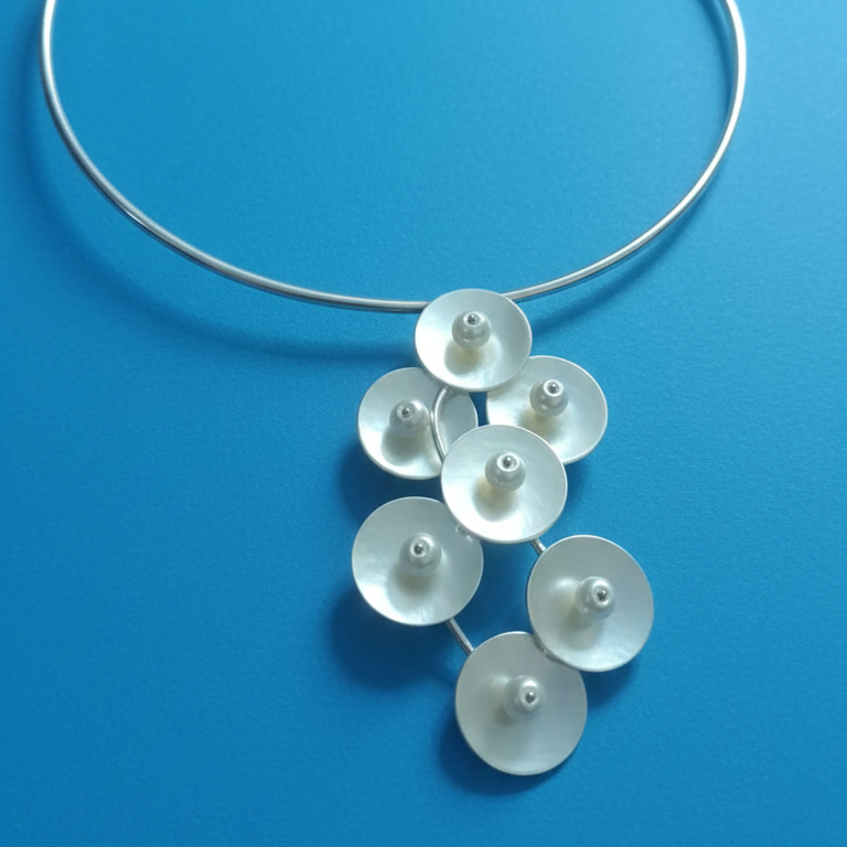 Elegant Silver Look Hasli Necklace Choker for women with beaded circular designs .