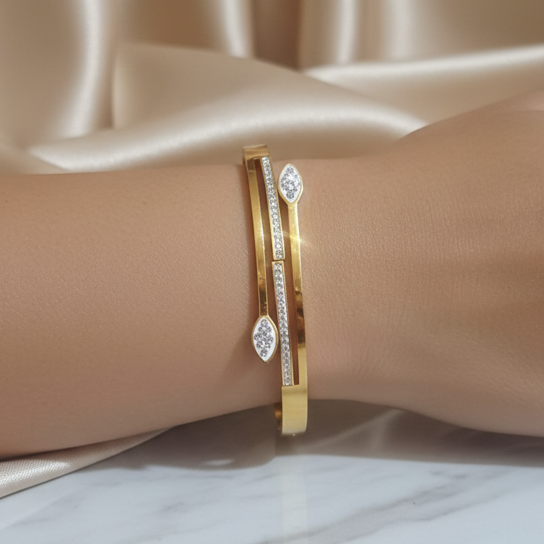 Designer Gold AD Bracelet on a woman's wrist, showcasing its sparkle and elegant design.
