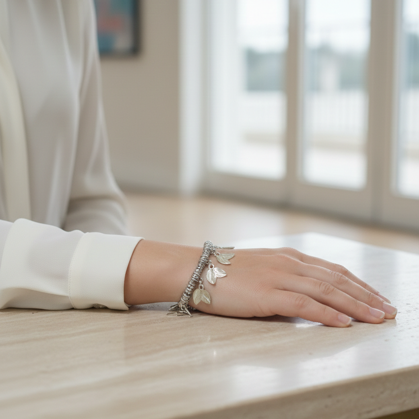 Person wearing aOxidized charm bracelet for western dresses