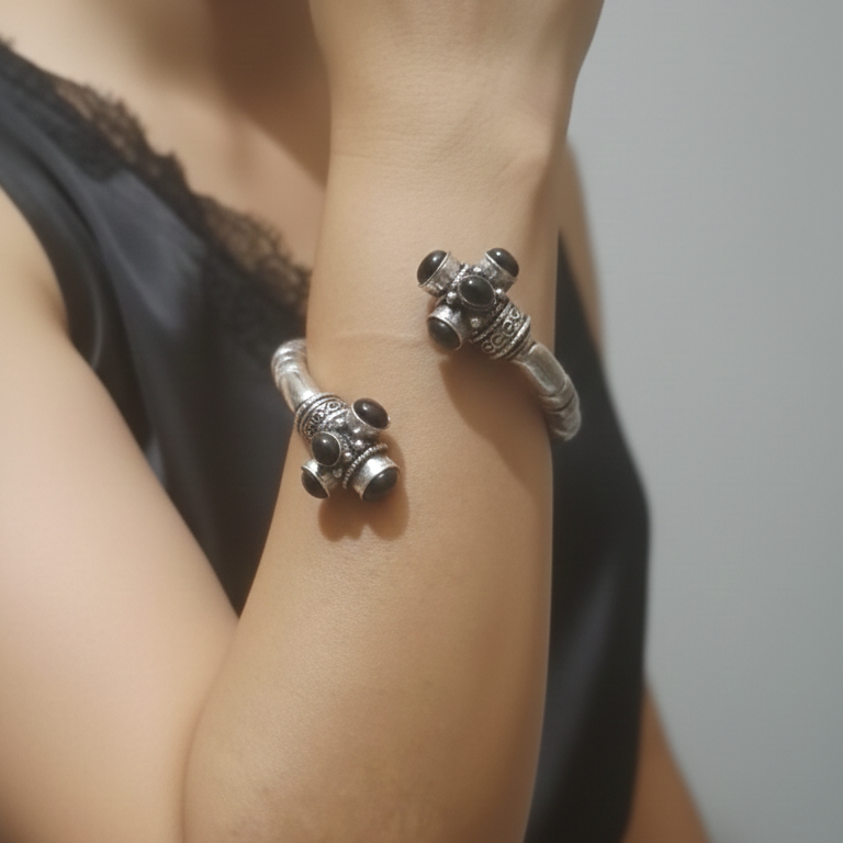 Silver bracelet on a wrist Close-up of a stylish oxidised kada showcasing its intricate detailing and vintage finish.