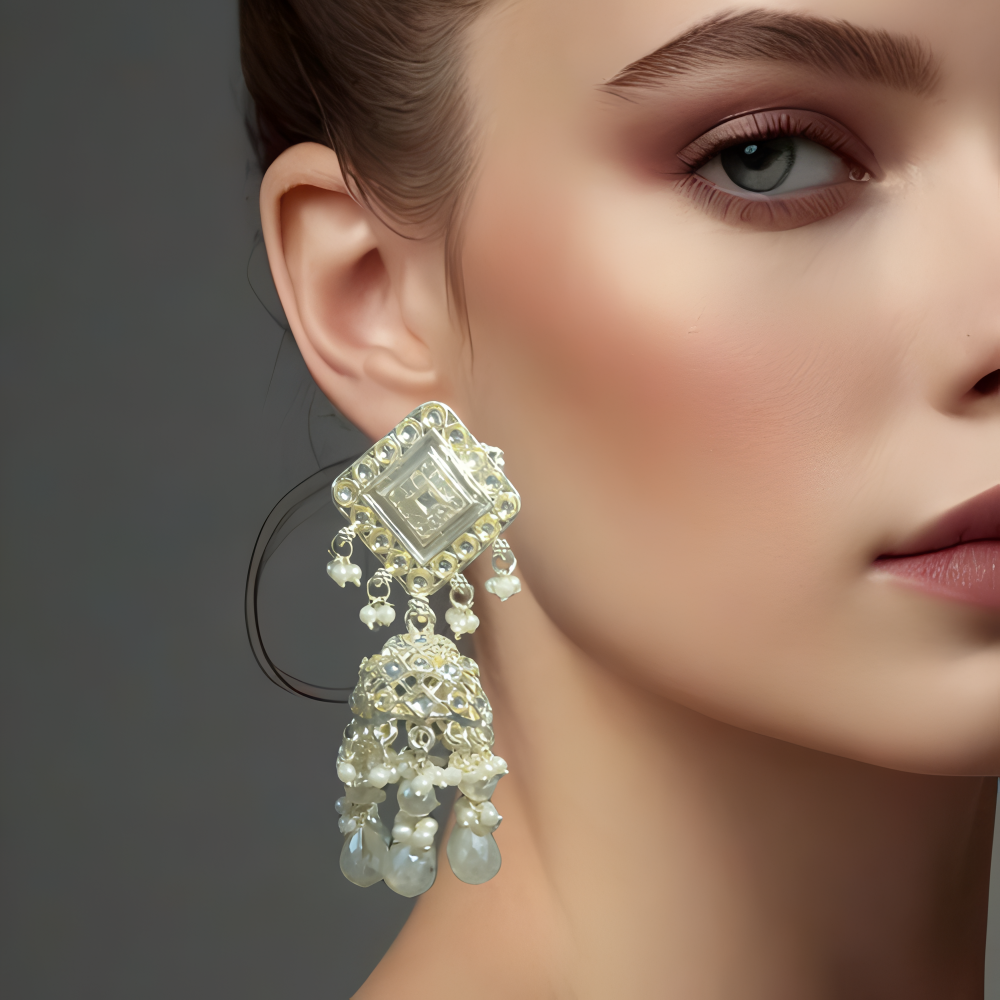 Close up of a model wearing long white jhumka with beads & stone