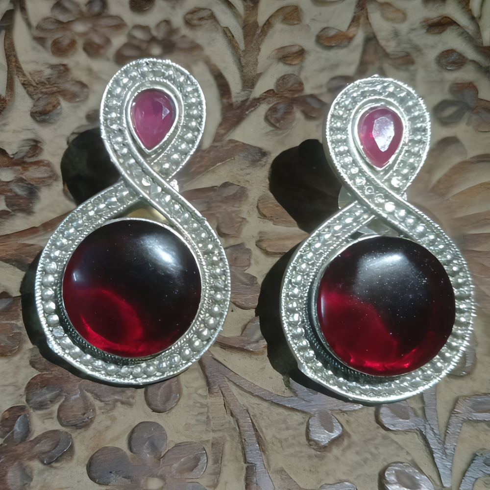 Pair of unique silver oxidised red stone earrings for every occasion.