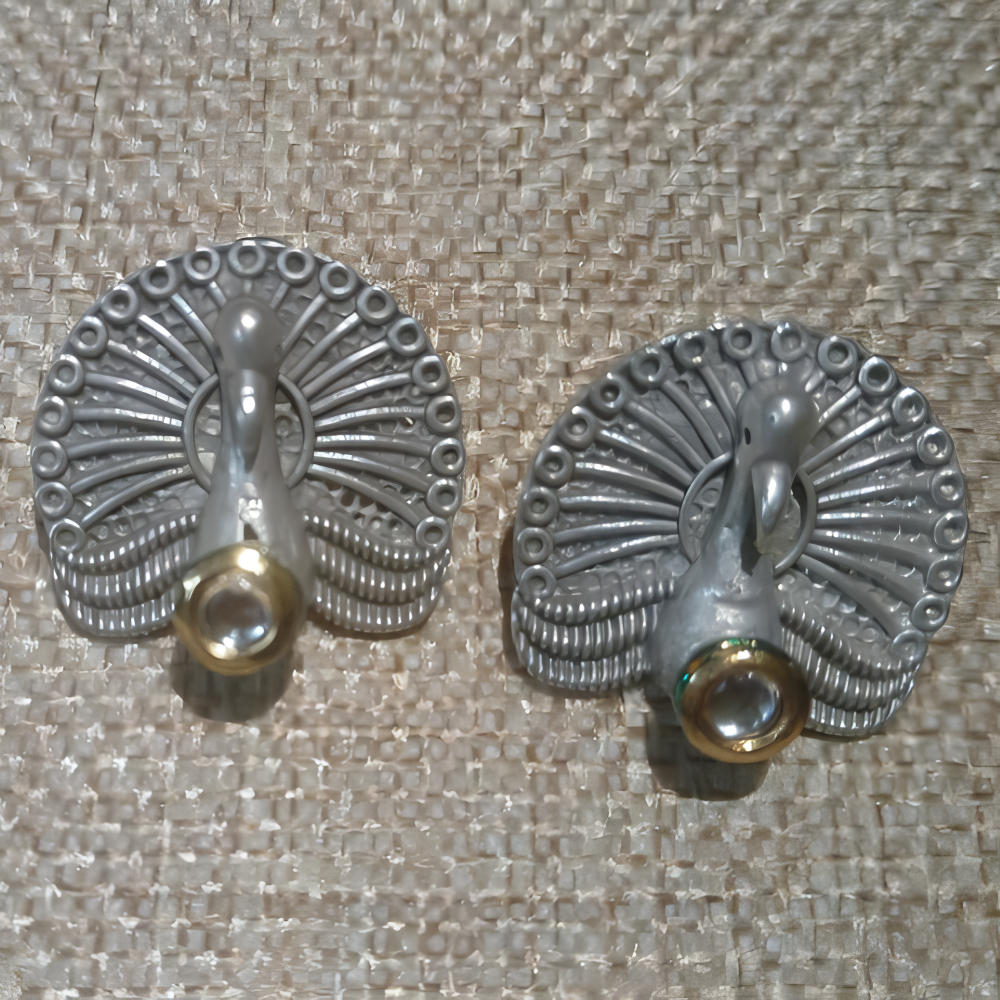 Pair of silver peacock-shaped earrings for women 