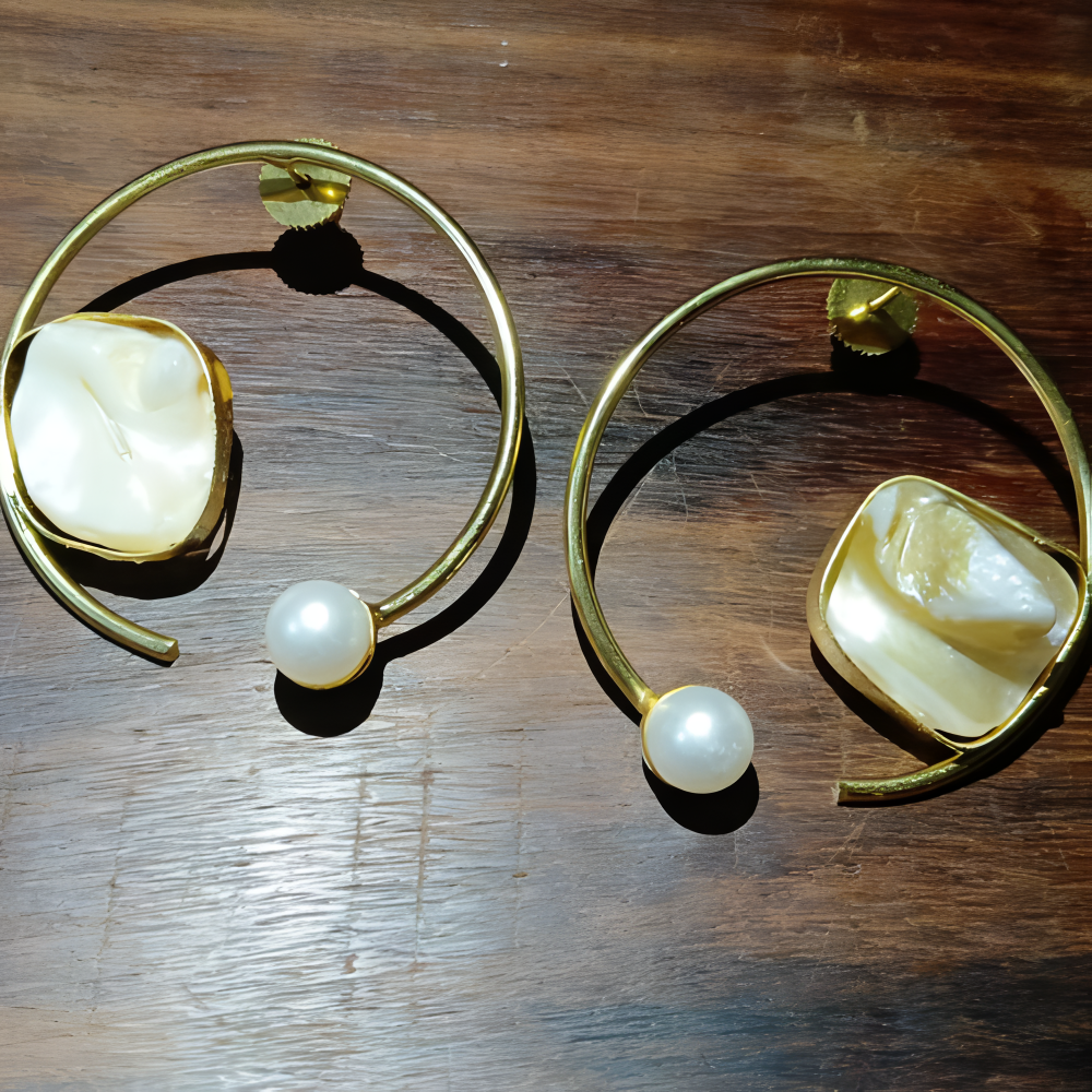 Gold hoop look stud earrings for women with large central stones and smaller pearls 