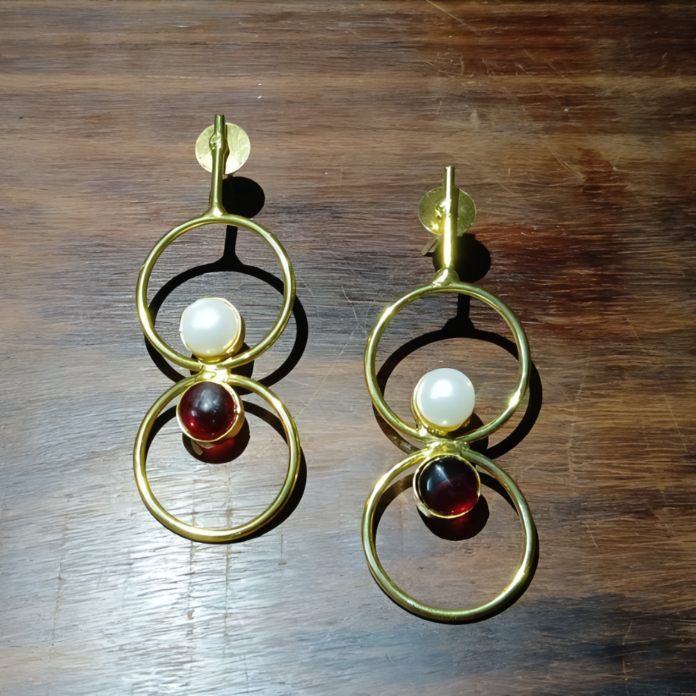 Gold earrings for women with circular designs and colored stones 