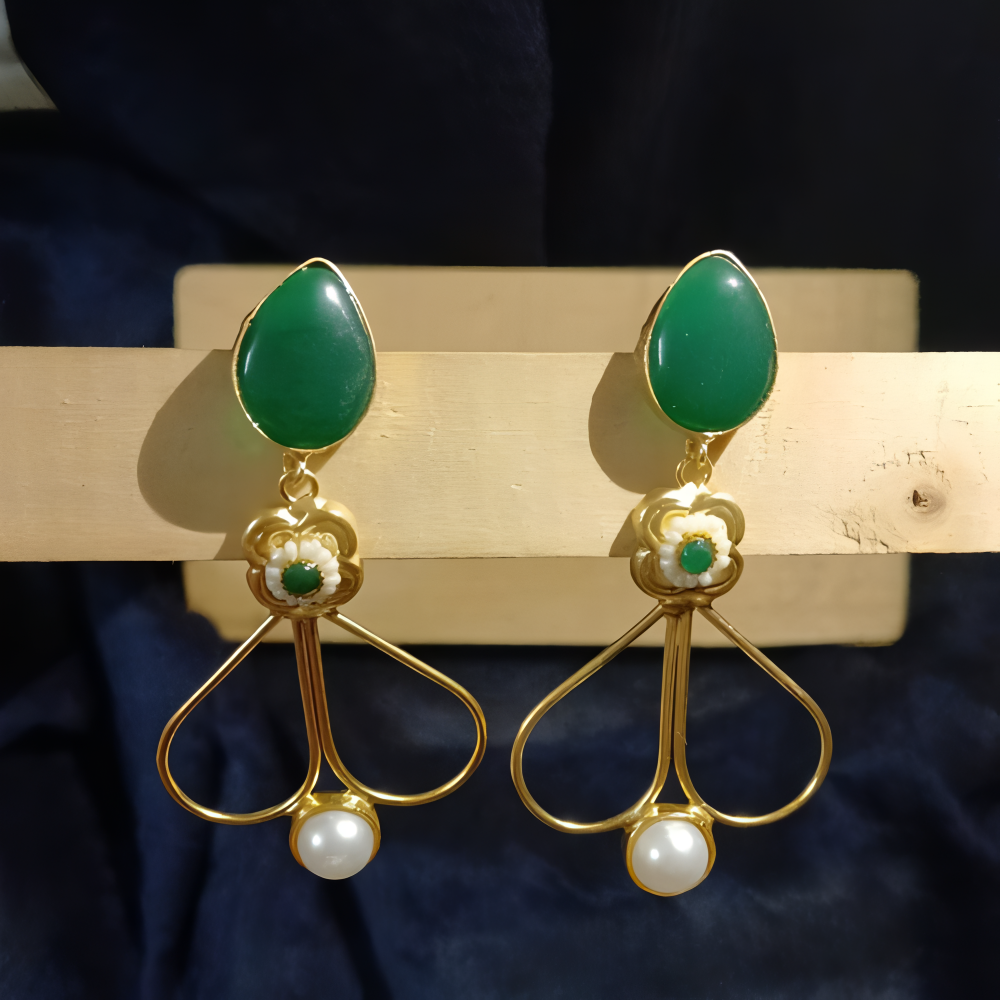 Pair of gold dangle earrings for women