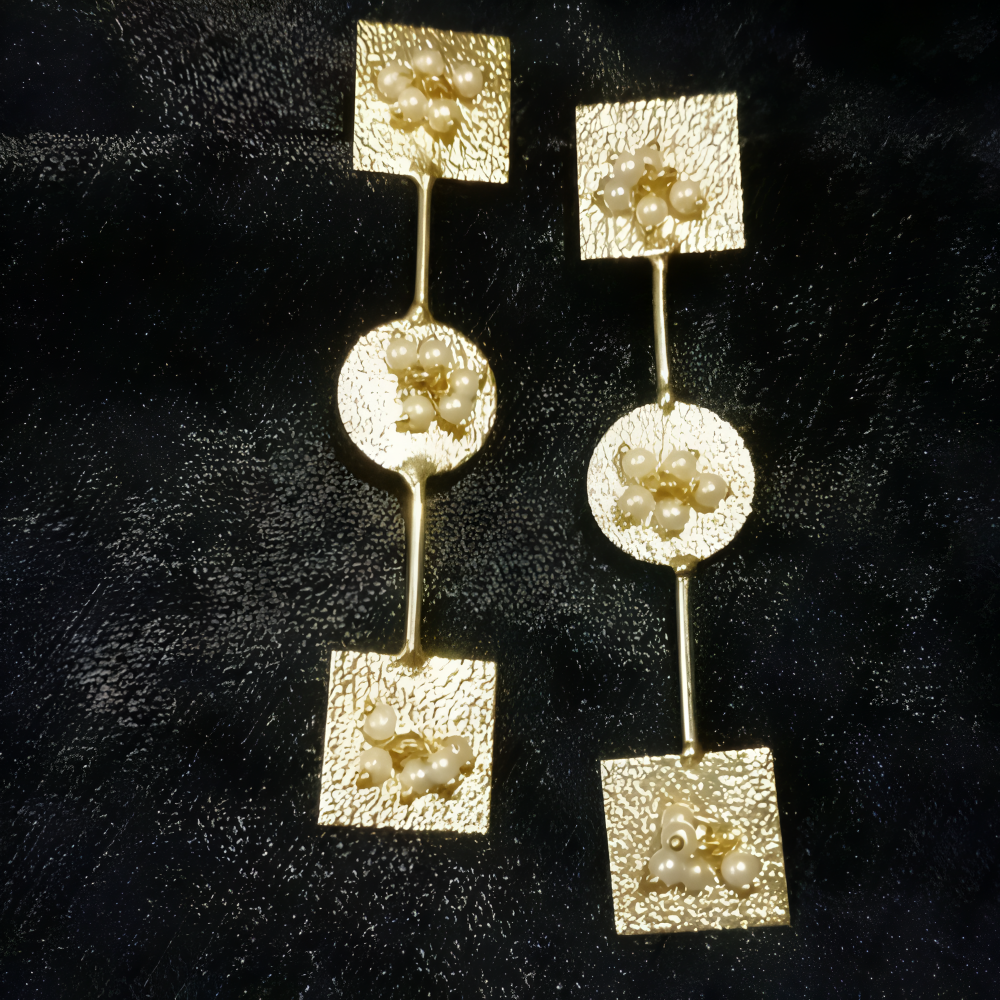 Long statement golden earrings with pearls