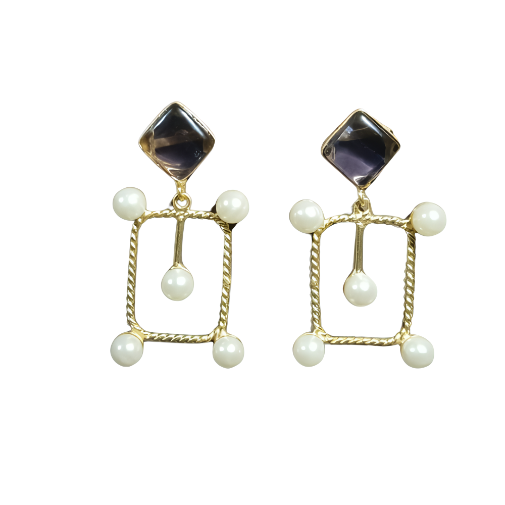 Pair of designer earrings with gold frames, transparent dark stones, and pearl droplets .