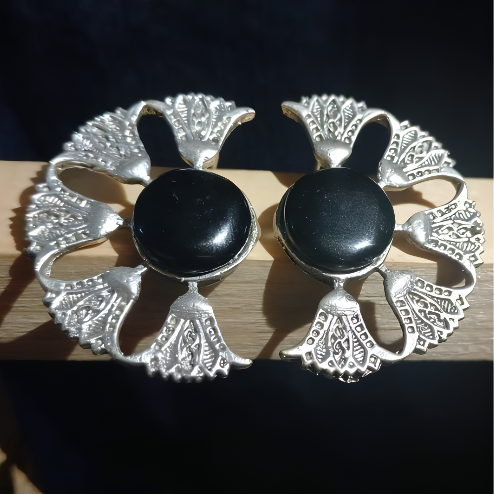Cresent moon shaped earrings with black stone studded at centre