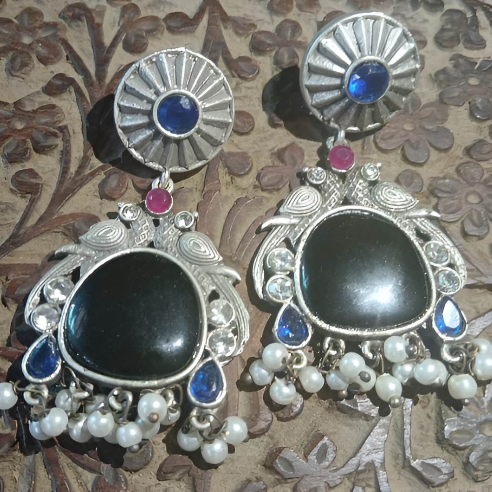 Partywear traditional black mossianite stone dangle peacock design earrings .