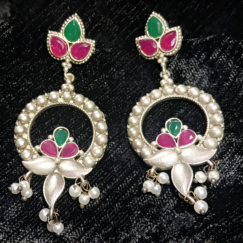 Pair of ornate dangle earrings with green, pink, and pearl details 