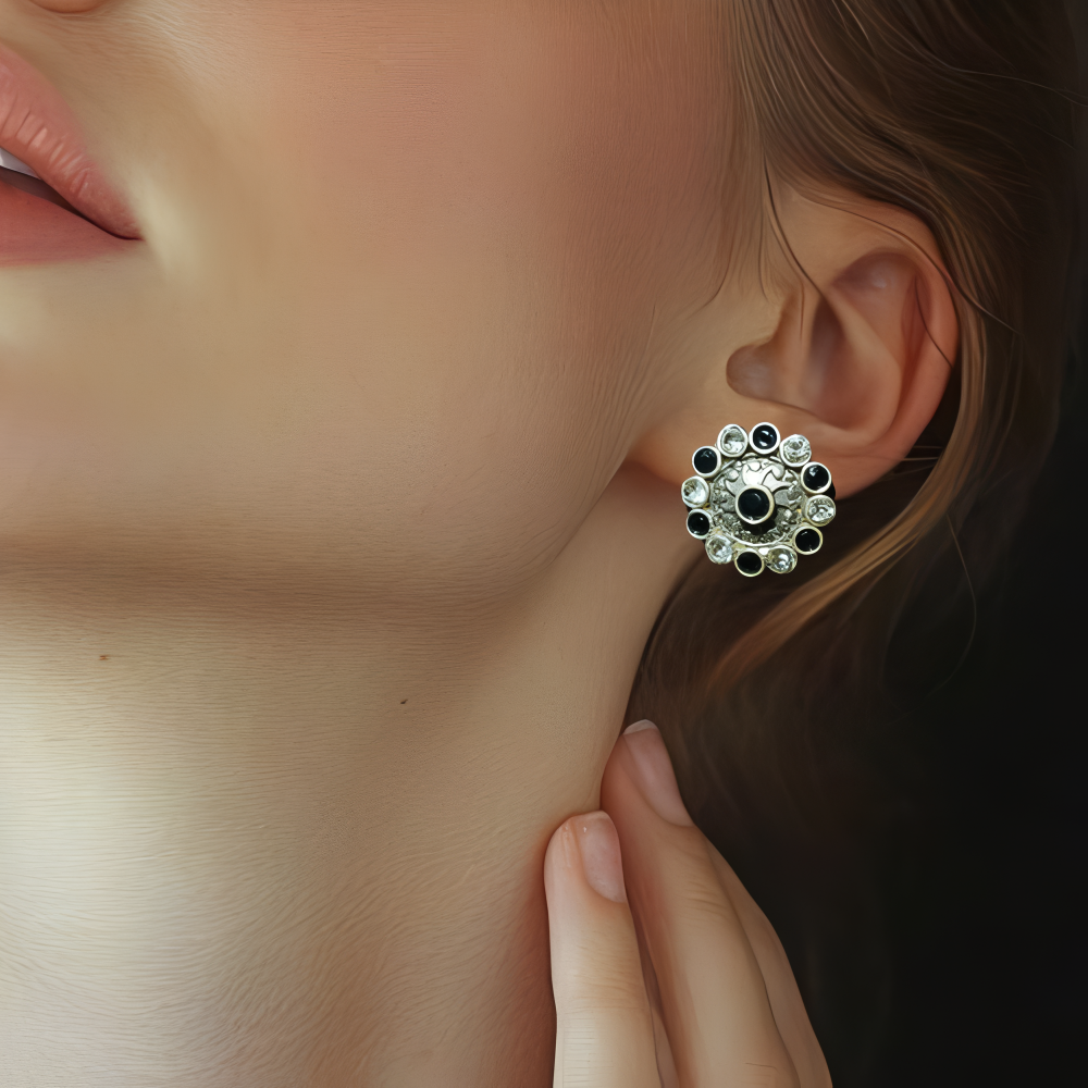 Close-up of a lady wearing an elegant stud kundan earring with intricate design.