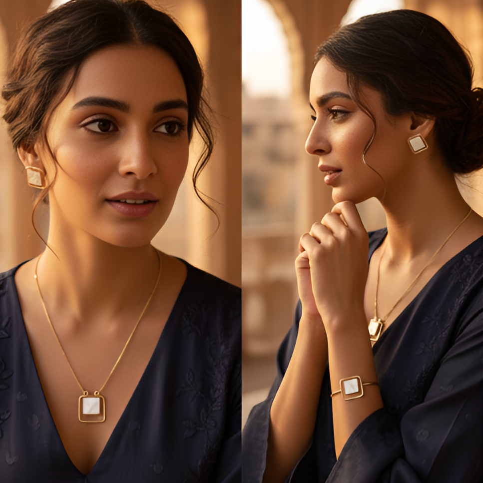 Woman wearing gold jewelry with a neutral background