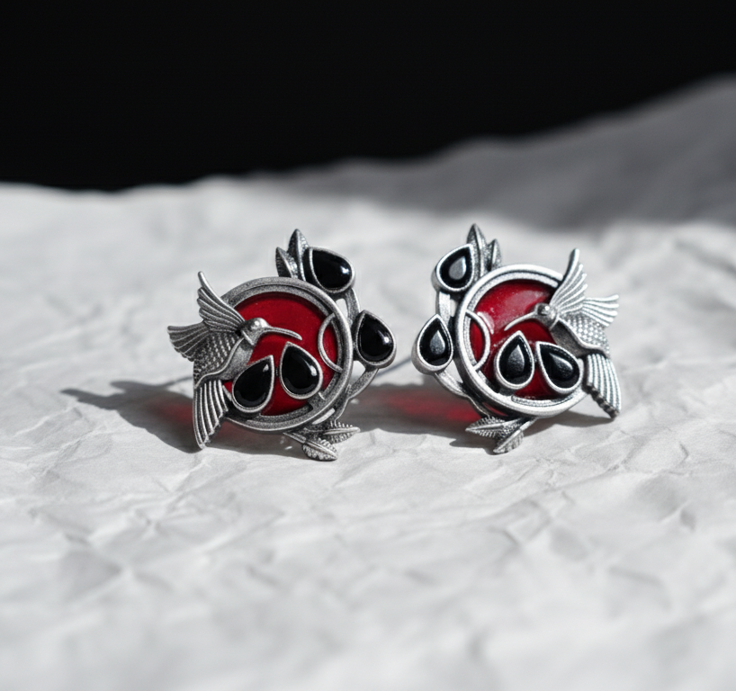 Silver stud multicolor earrings with intricate detaling .